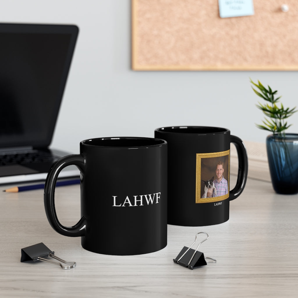 two black lahwf mugs displayed in a workspace